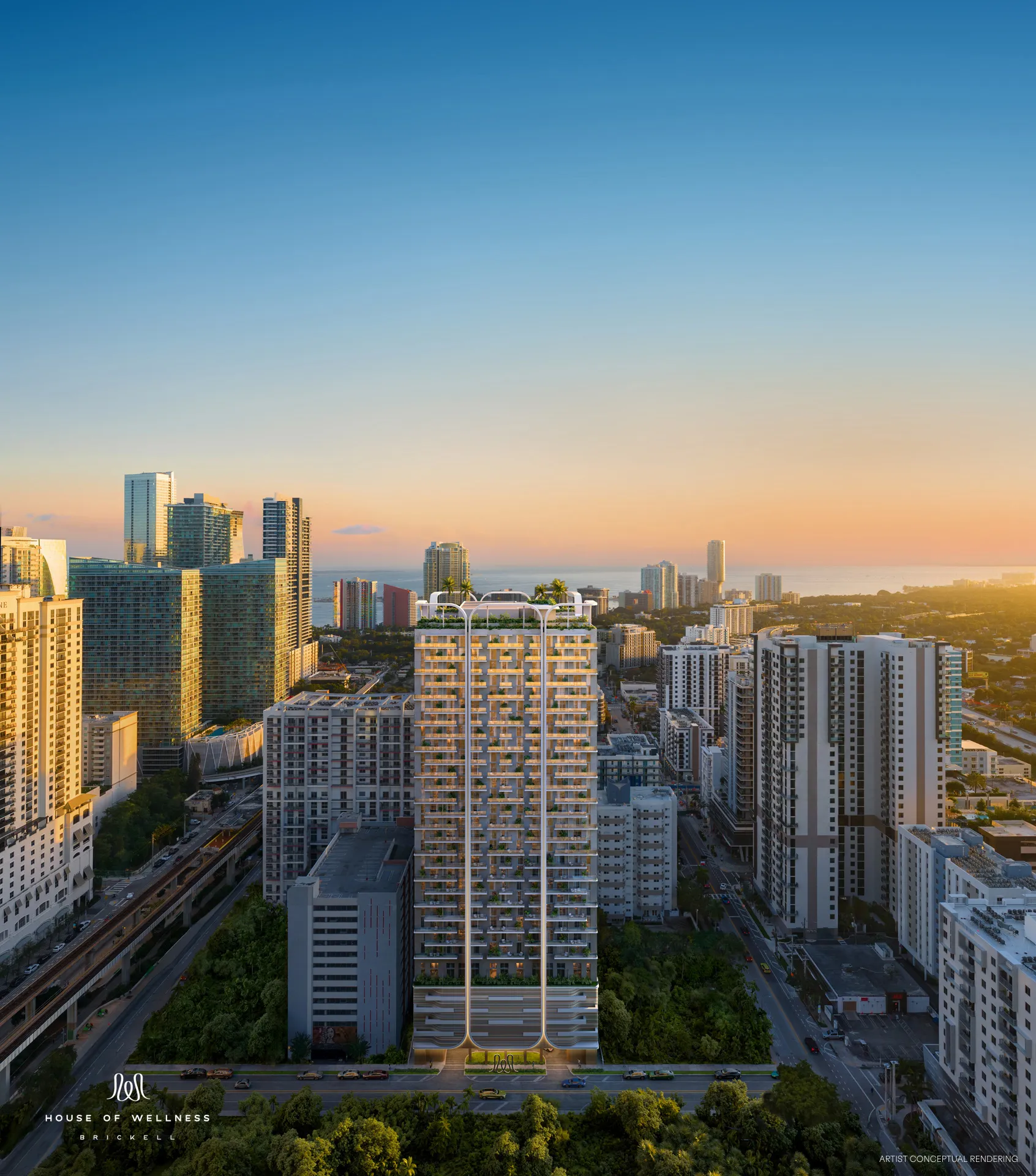 The House of Wellness tower in Brickell, Miami, at sunset with the city skyline behind it